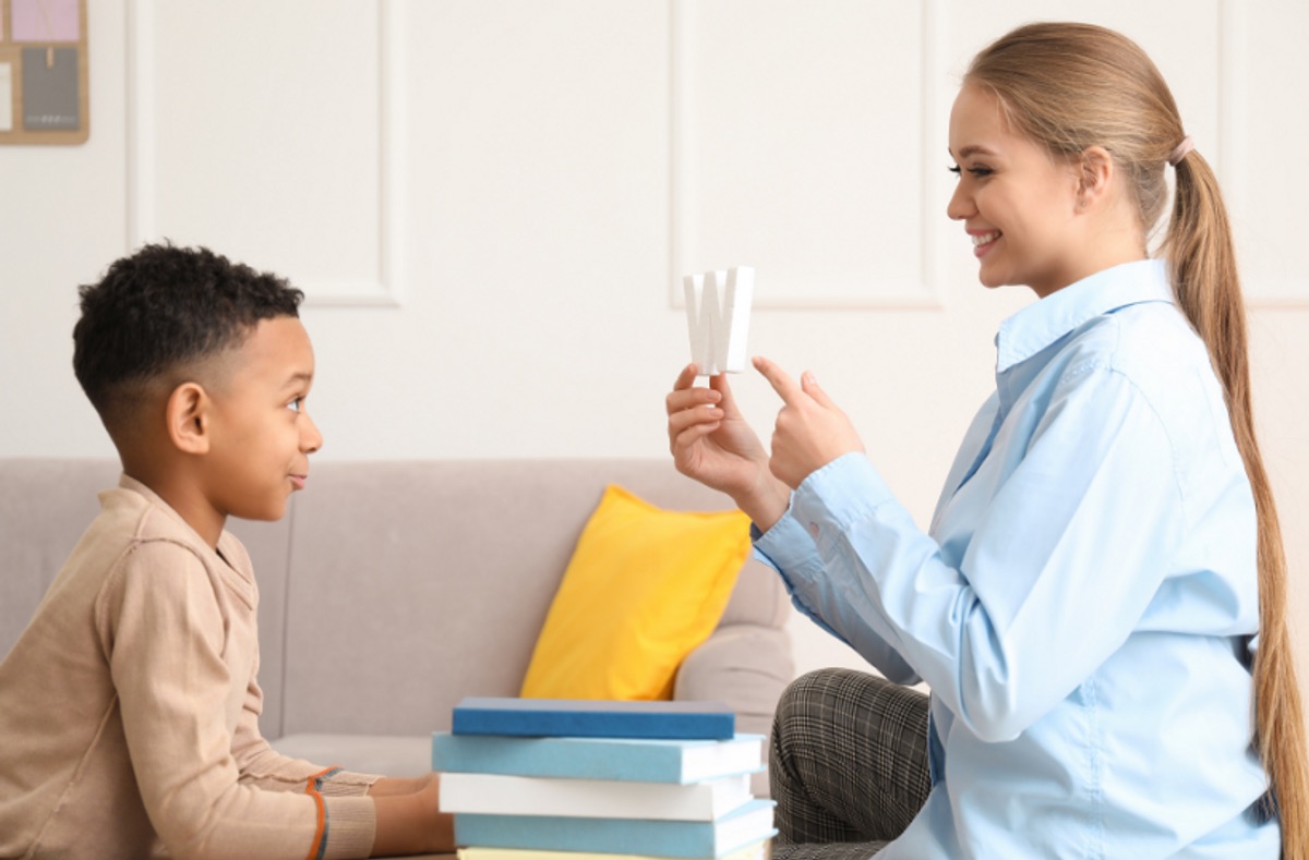 A parent using ABA strategies at home with a child